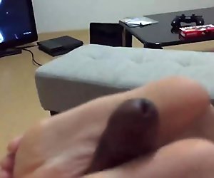 timid footjob while watching anime