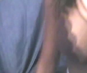 Leggy brunette blows cock standing on her knees