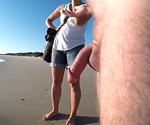 Nude Male Talk on a Clothed Beach